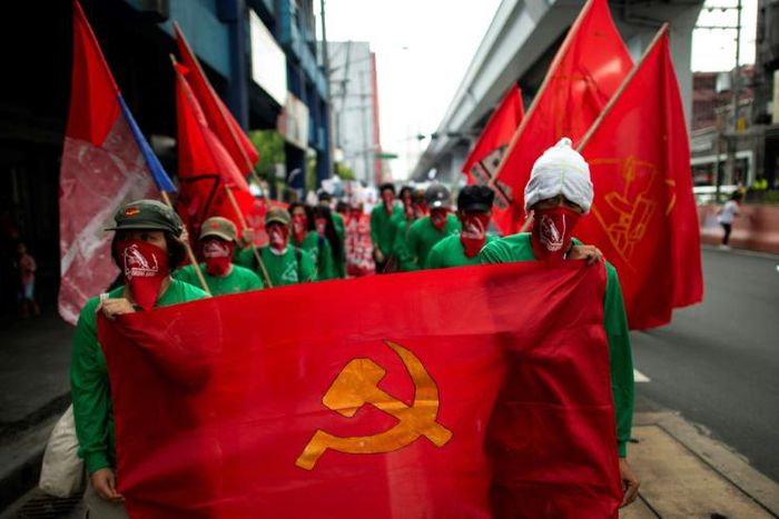 Members of the Philippine communist movement hold a protest in Manila in March calling for the resumption of peace talks with the government