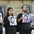 Journalists hold up photos of slain colleagues at a rally in Mexico City in June 2018