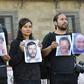 Journalists hold up photos of slain colleagues at a rally in Mexico City in June 2018