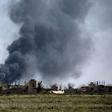 Black smoke billows during battles between the US-backed Syrian Democratic Forces and holdout jihadists of the Islamic State group in the village of Baghouz near Syria's border with Iraq