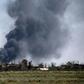 Black smoke billows during battles between the US-backed Syrian Democratic Forces and holdout jihadists of the Islamic State group in the village of Baghouz near Syria's border with Iraq