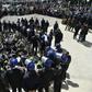 Algerian riot police come face to face with anti-government protesters in the capital Algiers