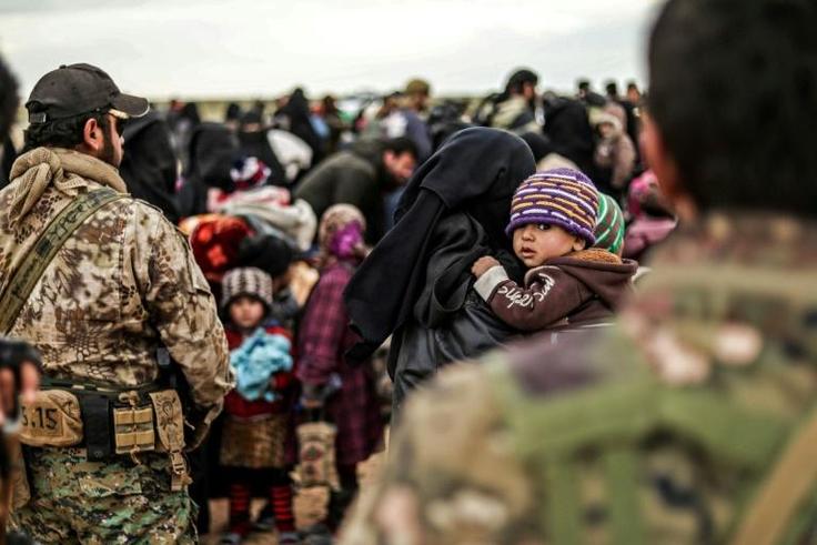 The US-backed Syrian Democratic Forces are evacuating hundreds of people from the ruins of the Islamic State groups's "caliphate" but up to several thousand more remain and commanders want to hold off a final offensive until they too are brought out