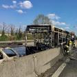 Picture by the Italian fire and rescue service shows the burned out wreckage of a school bus after police rescued some 50 children when their driver torched the vehicle