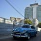 Old American cars drive near the emblematic Hotel Habana Libre, which could be affected if the United States activated Title III of the Helms-Burton Act