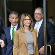 "Full House" star Lori Loughlin (C) and her husband, designer Mossimo Giannulli (L), were among 50 people indicted in the wide-ranging college bribery scandal
