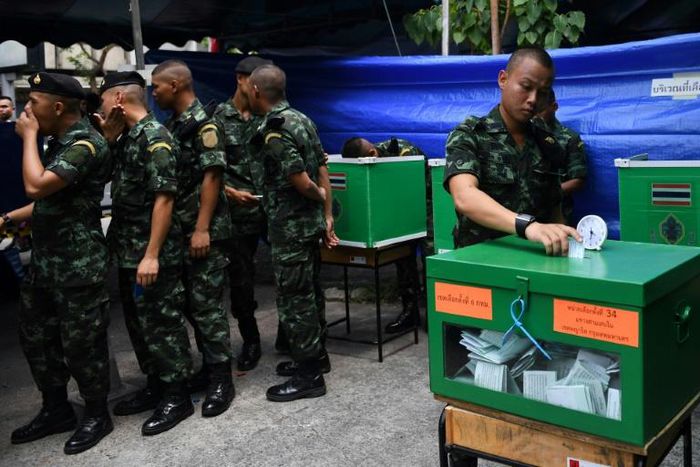 Royal Thai soldiers cast their ballots at a polling station in Bangkok