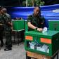 Royal Thai soldiers cast their ballots at a polling station in Bangkok