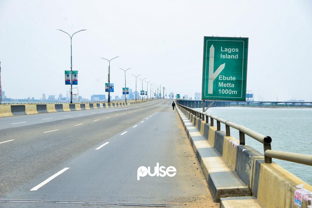 A lone man walks on Third Mainland Bridge (Pulse)
