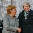 May, shown here in December with Angela Merkel, will meet her again on Tuesday in a last-gasp bid to prevent a hard Brexit