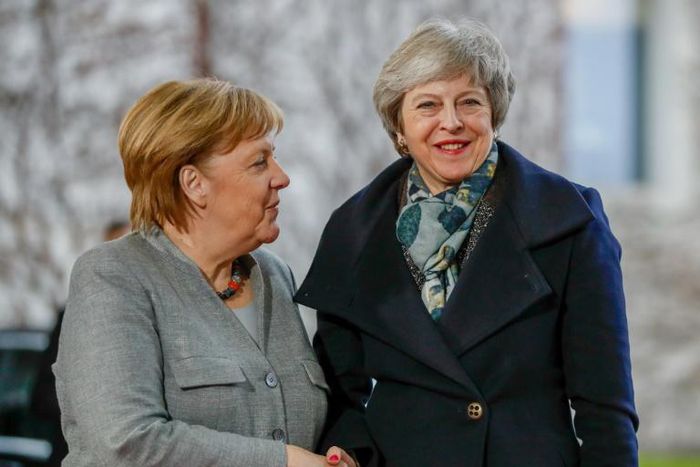 May, shown here in December with Angela Merkel, will meet her again on Tuesday in a last-gasp bid to prevent a hard Brexit