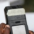 Voters can only cast their ballot by showing a biometric card, which is checked in a hand-held reader