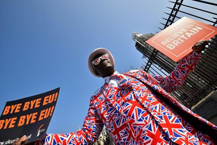 Pro-Brexit activist Joseph Afrane demonstrates outside the Houses of Parliament, but London as a whole voted overwhelmingly in favour of remaining in the EU