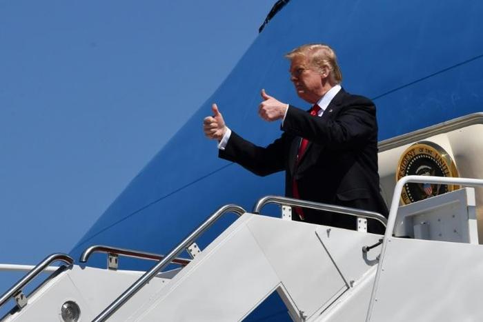 US President Donald Trump says the Islamic State group has been "100 percent" defeated in Syria