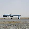 A US Predator drone armed with a missile stands on the tarmac of Kandahar military airport in Afghanistan