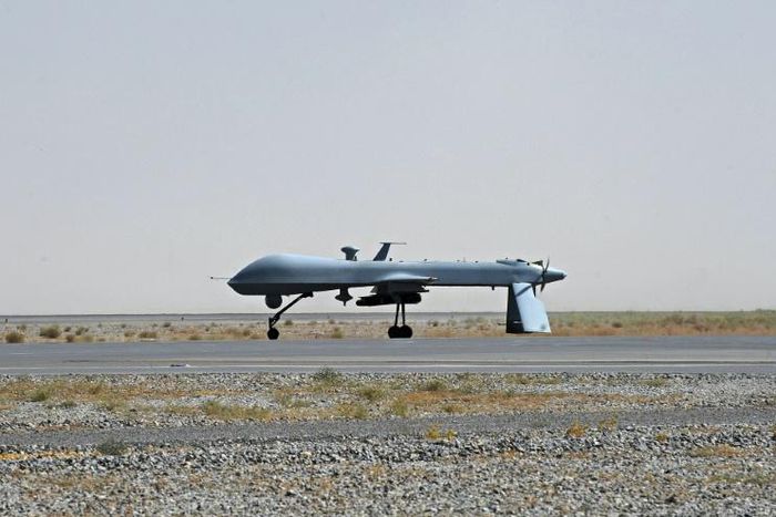 A US Predator drone armed with a missile stands on the tarmac of Kandahar military airport in Afghanistan