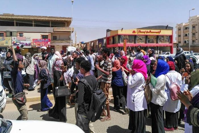Protesters shout slogans during an anti-government demonstration in Street 60 in the Sudanese capital Khartoum