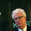 Ken Follett alongside an advertisement for his "The Pillars of the Earth" bestseller -- one of whose scenes is set in a Parisian cathedral that readers may very well assume is Notre-Dame