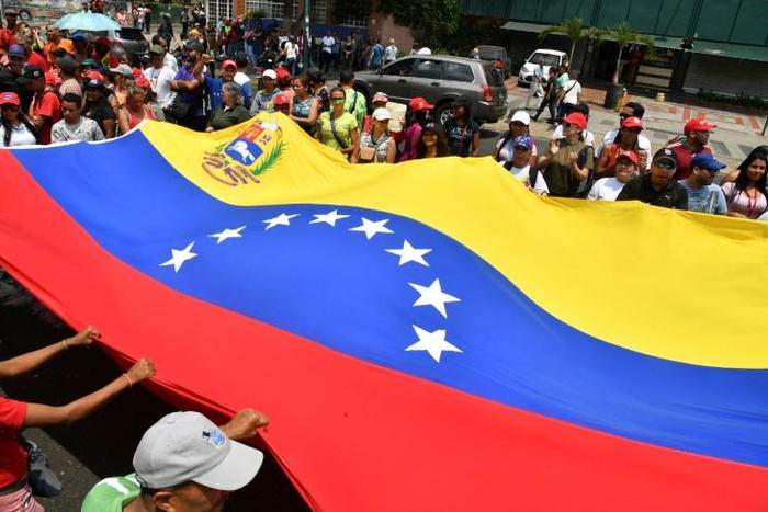 Supporters of Venezuela's Nicolas Maduro march in Caracas show their support for the socialist regime