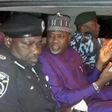 Kano State deputy governor, Nasir Gawuna (middle), flanked by police officers