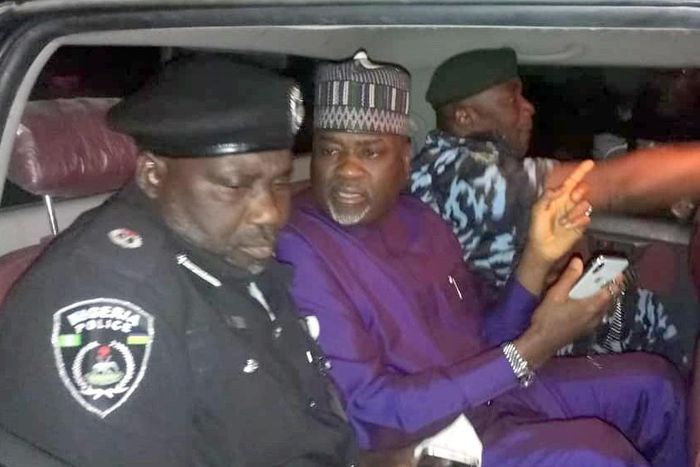 Kano State deputy governor, Nasir Gawuna (middle), flanked by police officers