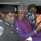 Kano State deputy governor, Nasir Gawuna (middle), flanked by police officers