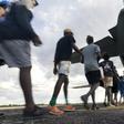 Residents of McArthur River, a remote town in the Northern Territory, boarding an Australian military plane as authorities evacuate communities in the path of a powerful cyclone