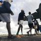Residents of McArthur River, a remote town in the Northern Territory, boarding an Australian military plane as authorities evacuate communities in the path of a powerful cyclone