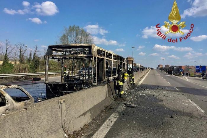 Picture by the Italian fire and rescue service shows the burned out wreckage of a school bus after police rescued some 50 children when their driver torched the vehicle