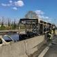 Picture by the Italian fire and rescue service shows the burned out wreckage of a school bus after police rescued some 50 children when their driver torched the vehicle