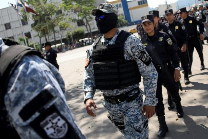 Salvadoran police like those pictured here February 2, struck a "heavy blow" to the Central American country's violent MS-13 gang, arresting 117 members