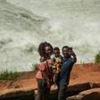 Big river: A family takes a selfie in front of the Nile during the Uganda National Kayaking Championships in Jinja in January. More than 250 people have died in selfie accidents around the world, according to a study published last year