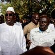 Incumbent President Macky Sall (C) is expected to win enough votes to claim a first-round victory, according to local media reports of regional vote tallies