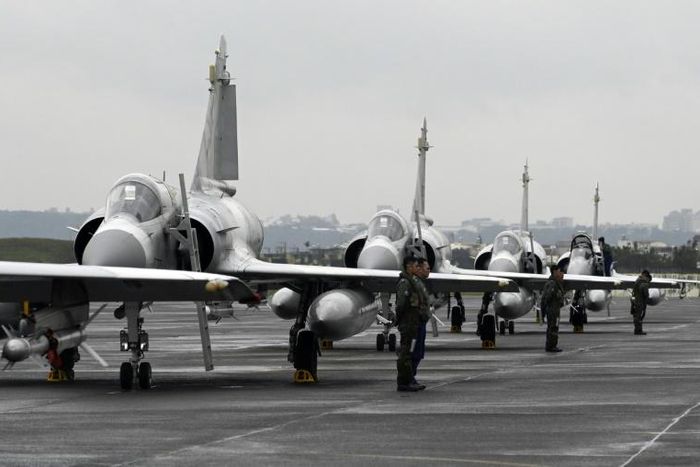 Taiwan air force pilots stand next to French-made Mirage fighter jets during an annual exercise at the Hsinchu base in January