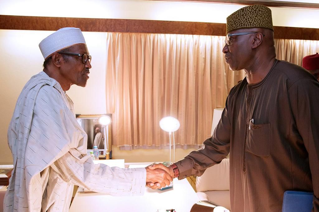 President Muhammadu Buhari shakes hands with Secretary to the Government of the Federation (SGF), Boss Mustapha