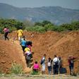 Venezuelans cross from their country through "trochas" -- illegal trails -- near the Simon Bolivar International Bridge into Colombia