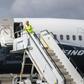 Boeing Chief Executive Dennis Muilenburg deplaning a Boeing 737 MAX after a test flight of the company's proposed fix to its anti-stall system