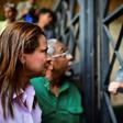 Venezuelan opposition deputy Dennis Fernandez (L) requests information on the detention of Roberto Marrero, the chief of staff of opposition leader and self-proclaimed interim president Juan Guaido, at the entrance of the intelligence service (SEBIN) h...