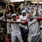 Supporters of President Buhari celebrate his re-election although the reaction was generally more muted than last time