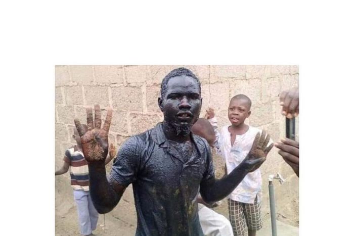 Haruna Bala fulfilled his promise by lying in a gutter for 10 minutes