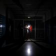 People stand on a dark corridor at Miguel Perez Carreno hospital, in Caracas, during the worst power outage in Venezuela's history