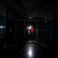 People stand on a dark corridor at Miguel Perez Carreno hospital, in Caracas, during the worst power outage in Venezuela's history