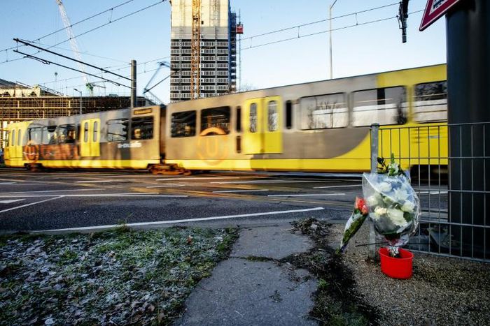 Flowers are displayed at 24 Oktoberplein, in Utrecht, on March 19, 2019, the day after three people were shot dead and several were injured, including one who later died, in a shooting on a tram