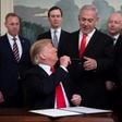US President Donald Trump hands his pen to Israeli Prime Minister Benjamin Netanyahu after signing a proclamation recognizing the Golan as Israeli territory despite UN resolutions that state the strategic plateau is Syrian