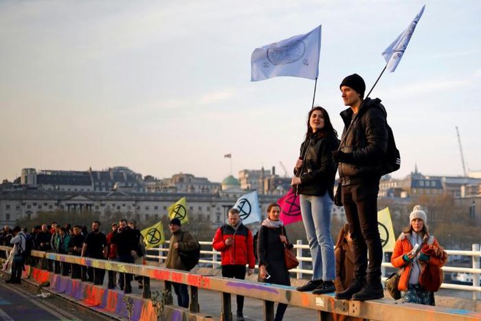 Climate protesters block off a bridge and major road in London, bringing parts of the city to a standstill