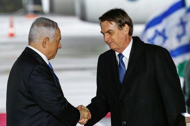 Brazilian President Jair Bolsonaro (R) was greeted on arrival in Israel by Prime Minister Benjamin Netanyahu