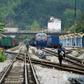 A Vietnamese soldier and railway worker inspect the track near the Dong Dang railway station, where North Korean leader Kim Jong Un is expected to arrive ahead of his summit with US President Donald Trump