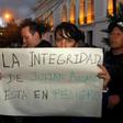 A protester outside the Foreign Ministry in Quito, Ecuador holds a placard reading "Assange's Safety is in Danger," after British police took WikiLeaks founder Julian Assange out of Ecuador's embassy in London and arrested him