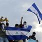 Anti-government demonstrators stage a protest on May 26, 2018 demanding Nicaraguan President Daniel Ortega and his wife, Vice President Rosario Murillo, to stand down, in Managua