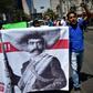 Teachers shout slogans carrying a banner depicting Mexican revolutionary leader Emiliano Zapata during a protest in Mexico City